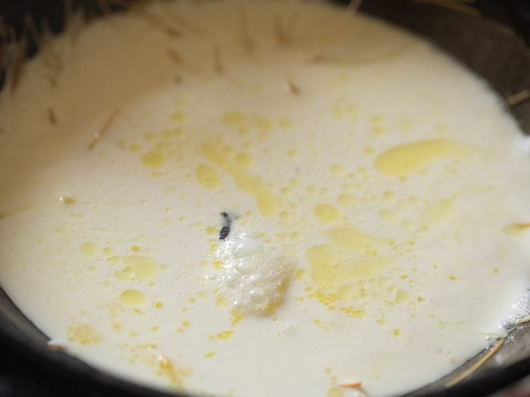 adding whole milk to pan