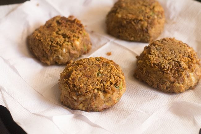 fried shami kabab placed on kitchen paper towels