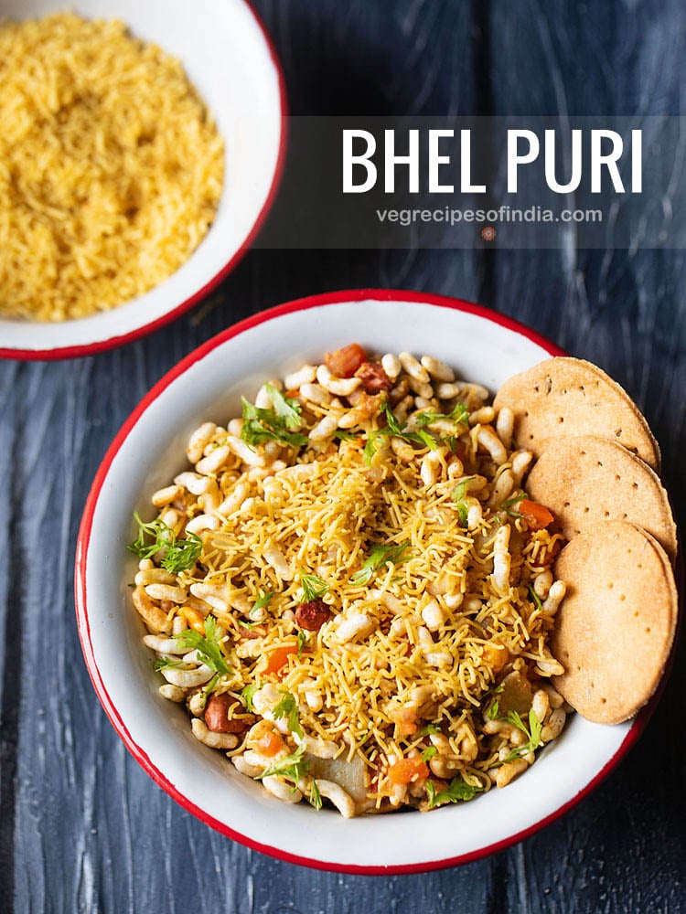 bhel puri served with a side of crisp baked puri in a red rimmed white bowl
