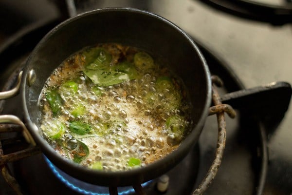 more spices and herbs getting fried in the oil