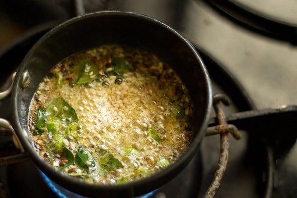 white sesame seeds added to the hot oil