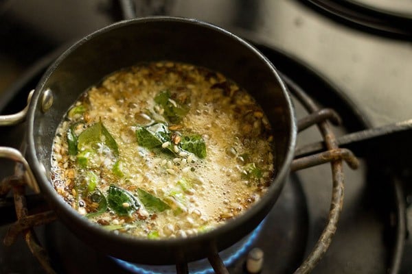 sesame seeds getting fried in oil