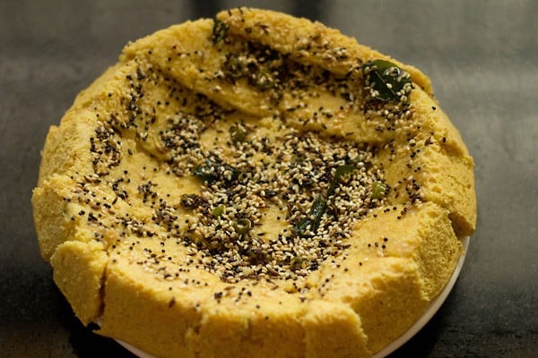 tempering mixture poured on the prepared khaman