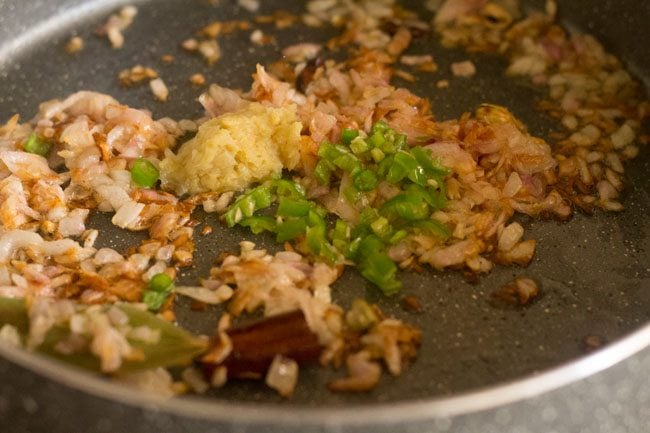 chiles and ginger garlic paste added to pan with onions and masala.