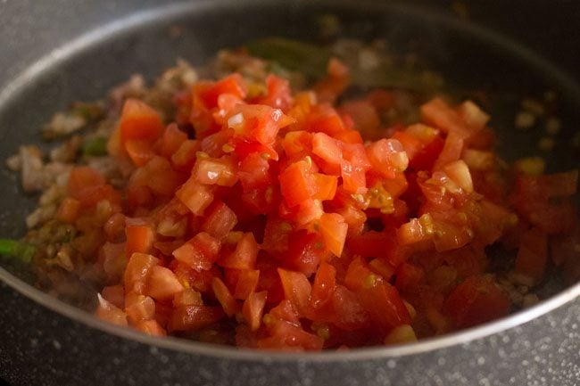 tomatoes added to pan.