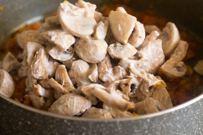 yogurt marinated mushrooms added to the masala.