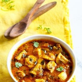 methi mushroom in a white bowl on a yellow napkin.