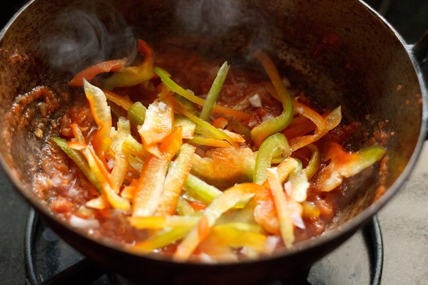 sliced green and red bell peppers added