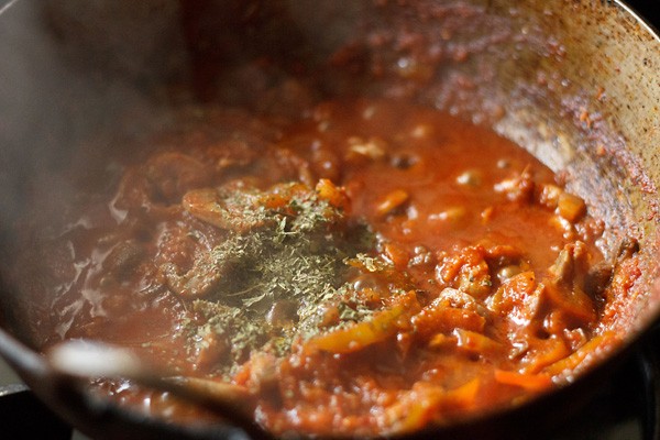 crushed kasuri methi added to the kadai mushroom gravy