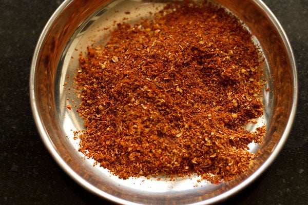 ground spices powder or kadai masala taken in a small steel plate