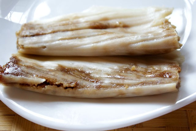 patholi served on a white plate. 