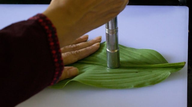 preparing the turmeric leaves for making patholi. 