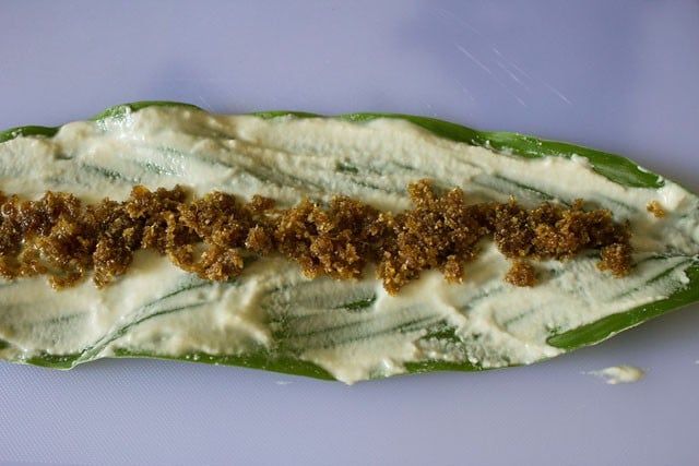 sweet filling added at the center of the turmeric leaf to make patoleo.