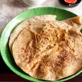 puran poli on a green plate.