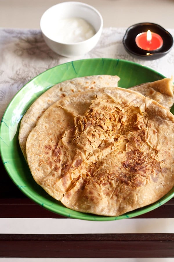 puran poli on a green plate.