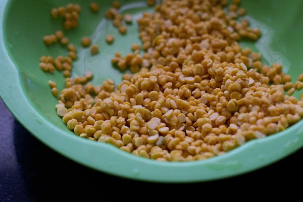 chana dal in a light green bowl