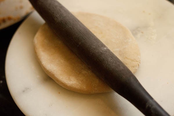 rolling stuffed poli with a rolling pin