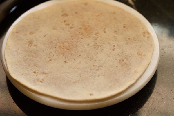 puran poli is rolled out thinly and is ready to cook