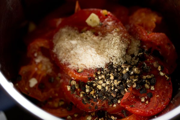 salt, pepper and sugar added to blender jar for making roasted tomato soup recipe.
