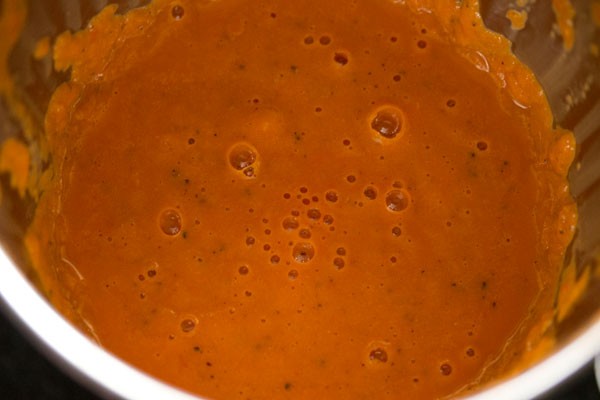 roasted tomato soup after blending - it looks orange-red and quite creamy.