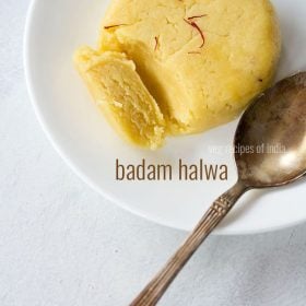 badam halwa served with copper spoon on white plate