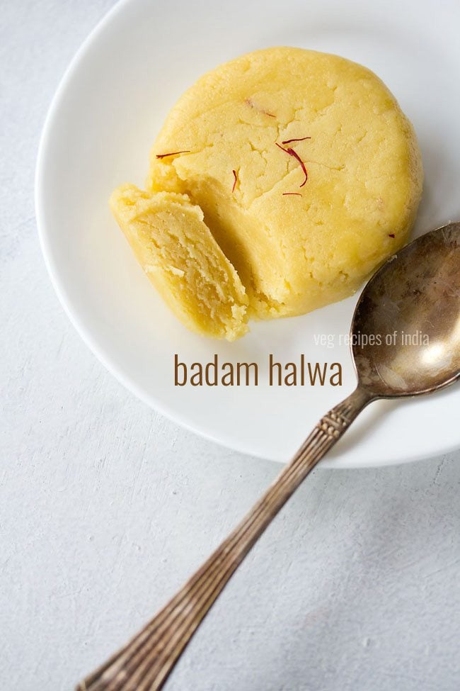 badam halwa served on a white plate with a brass spoon