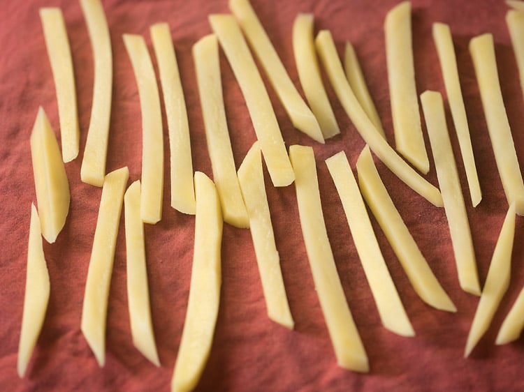 drying potato sticks on a towel