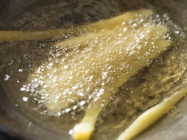 potatoes frying in oil for second time