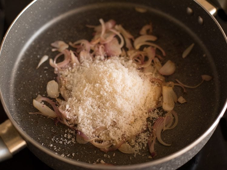 adding desiccated unsweetened coconut to the pan