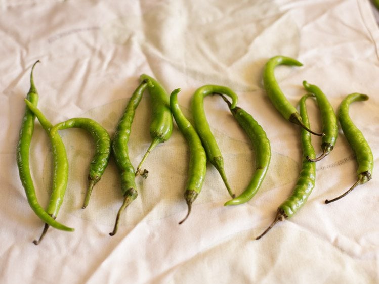 wiping green chilies till dry 