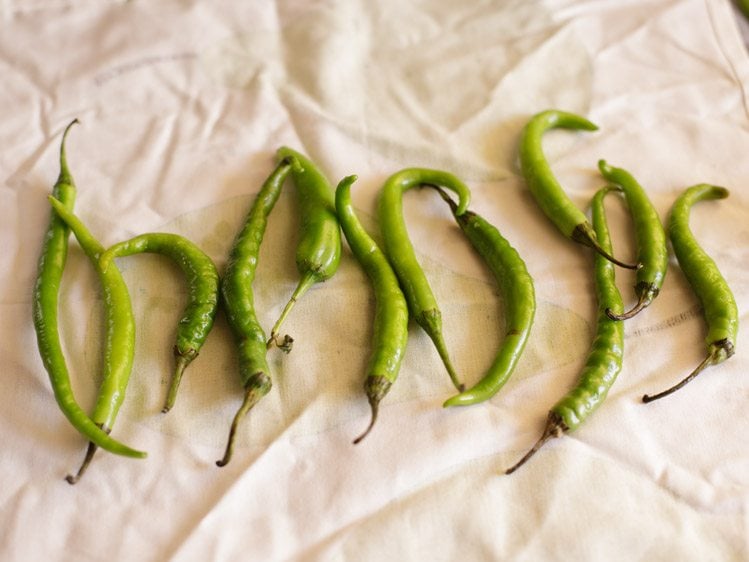 wiping green chilies till dry