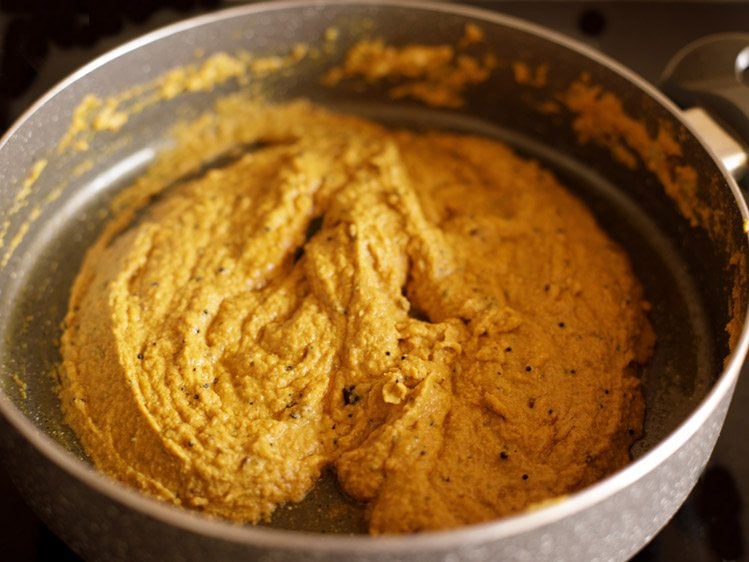 frying ground masala paste till oil floats on top
