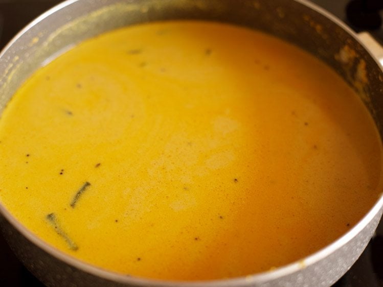 mixing masala paste mixture in pan