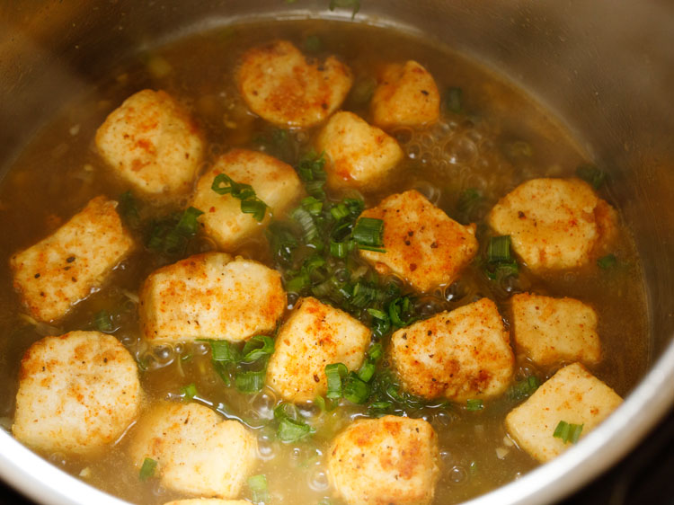 adding chopped spring onion greens