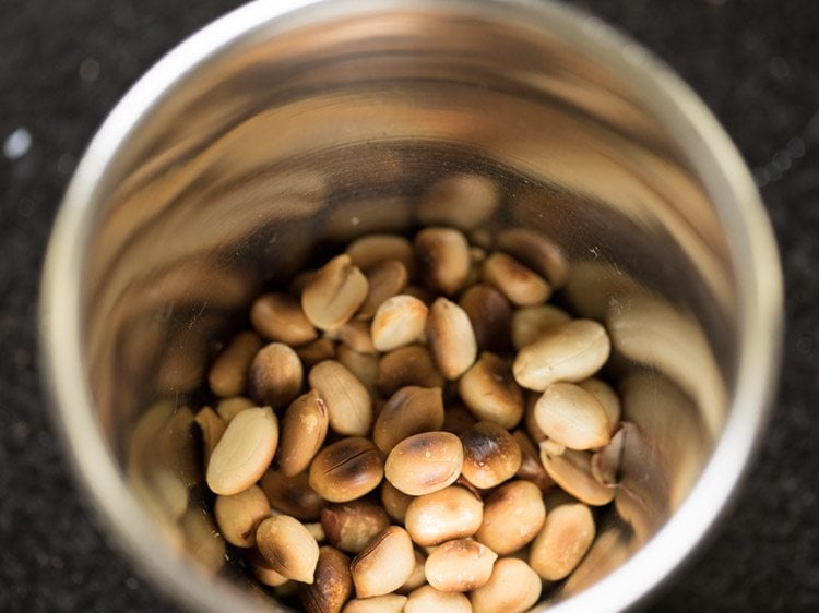 peanuts in a mortar pestle