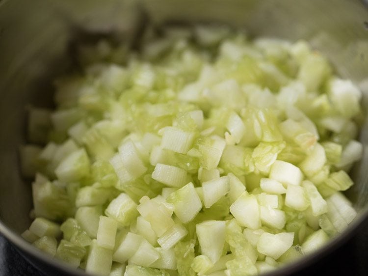 after squeezing water adding cucumber to a mixing bowl