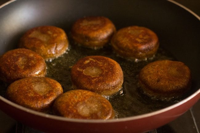 pan frying sweet potato cutlets in hot oil. 