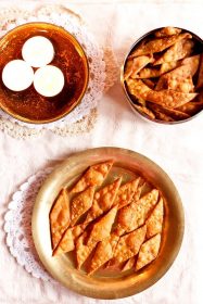 namak para served on a brass plate.