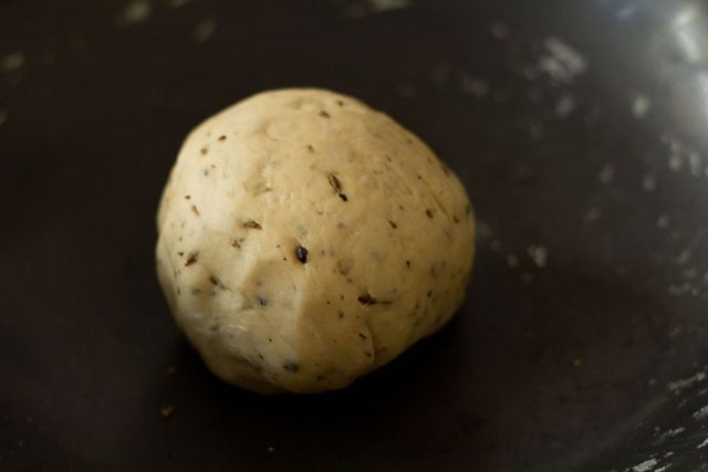 pastry dough in a black bowl for namak para recipe. 