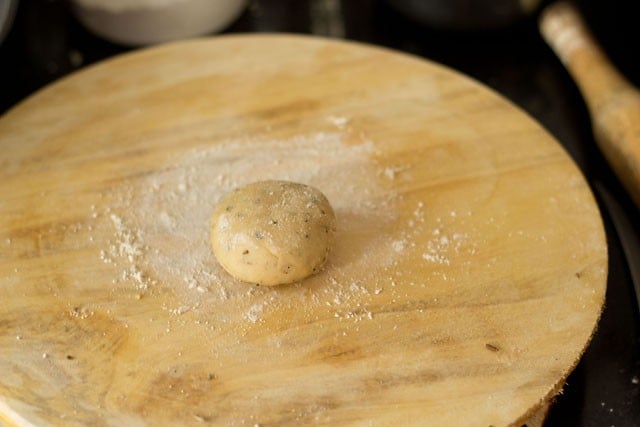 dough ball on a flour dusted surface. 