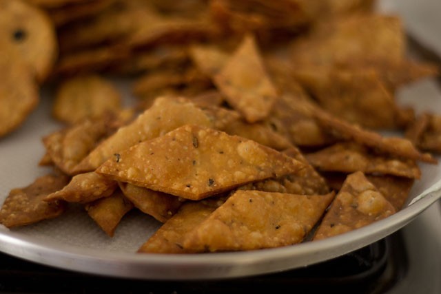 fried namak para on kitchen paper towel. 