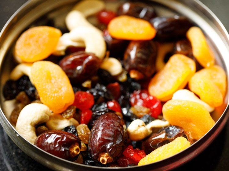 nuts and dried fruits in a steel bowl.