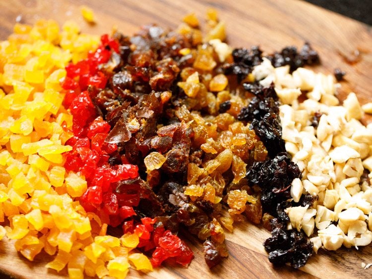 finely chopped nuts and dried fruits on a chopping board.