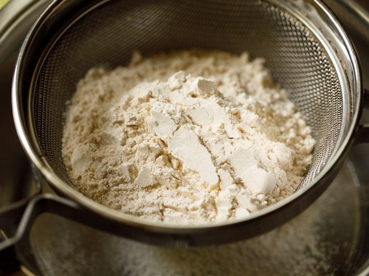 flours added in a sieve.