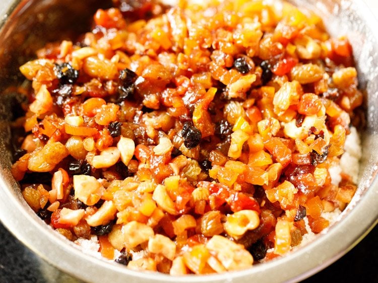 rum soaked dried fruits and nuts added to sifted flour.