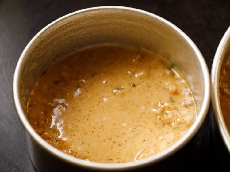 another portion of the fruit cake batter in a smaller pan