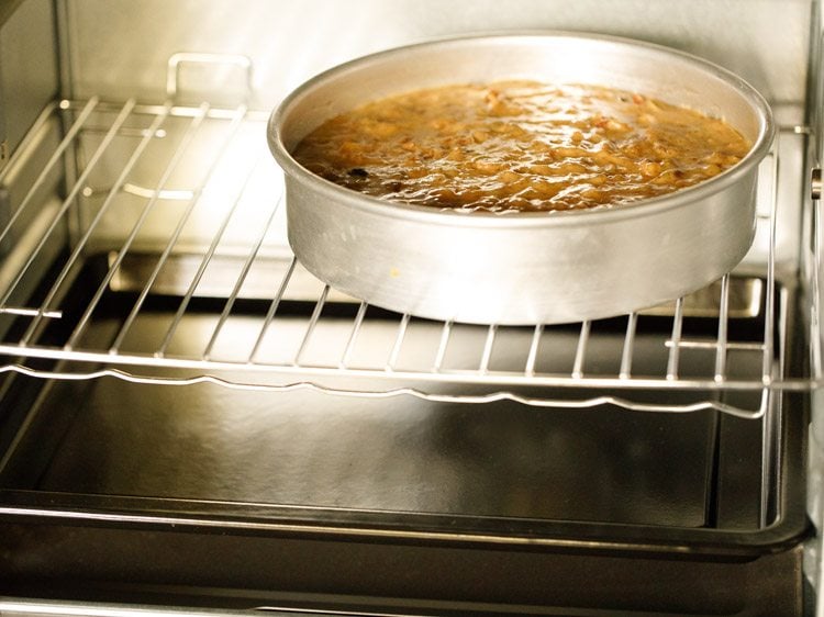 baking fruit cake batter in the oven.