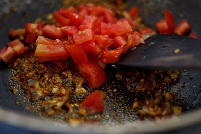 adding chopped tomato 