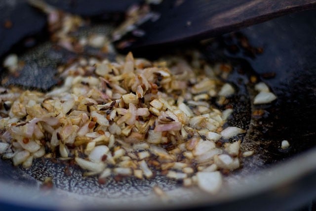 frying chopped onions till lightly browned 