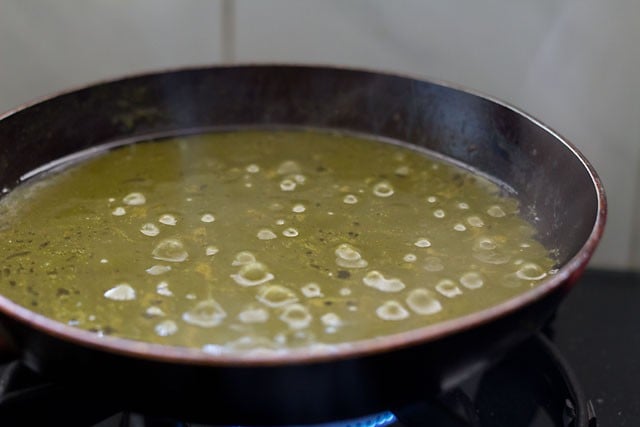 Added the cooked sarson ka saag to onions.